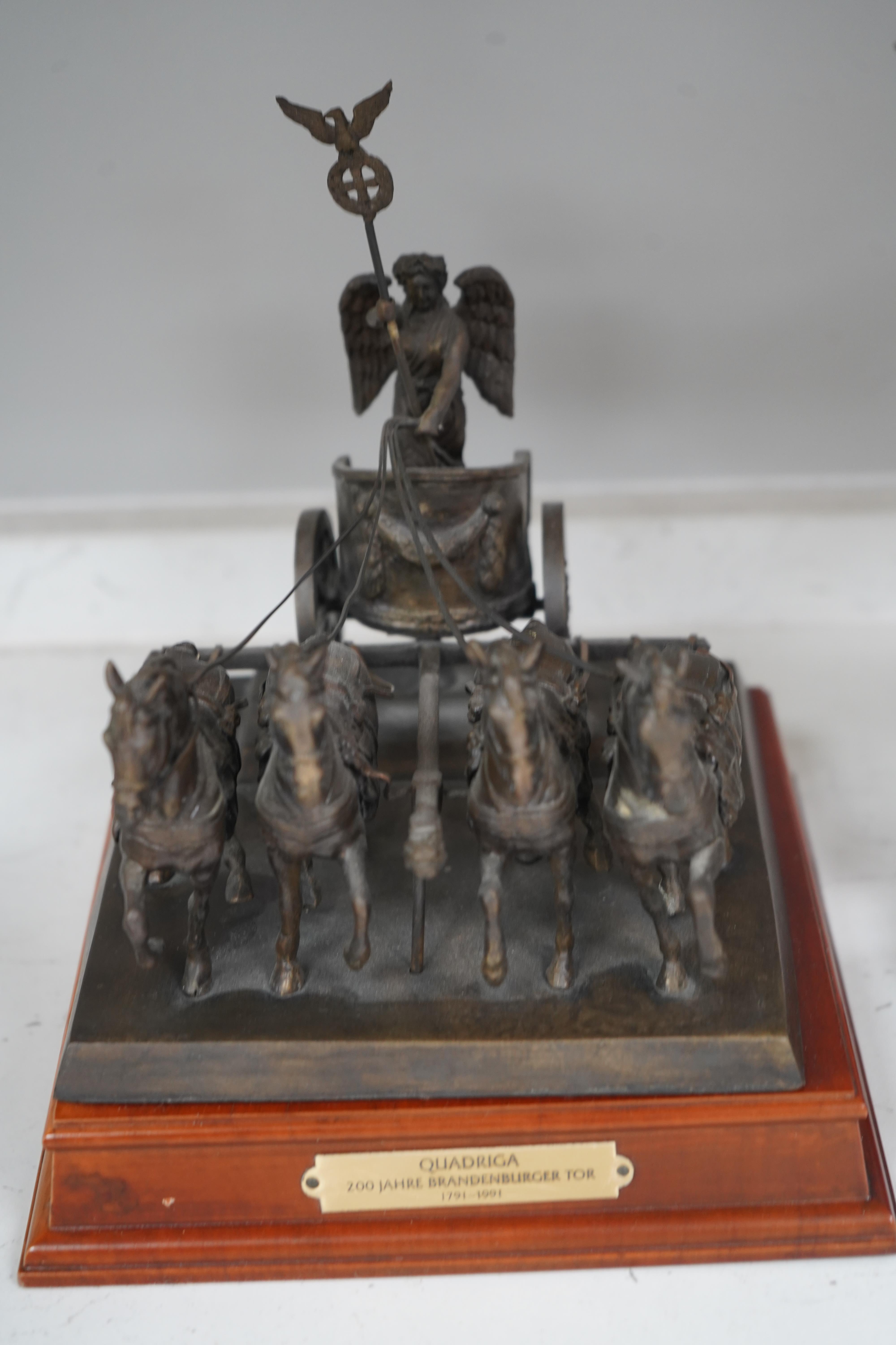 A Franklin Mint bronzed figure of an elephant, 'Giant of the Serengeti', and a Franklin Mint bronzed model 'Quadriga', on wooden plinth, with title plaque, largest 23.5cm. Condition - good